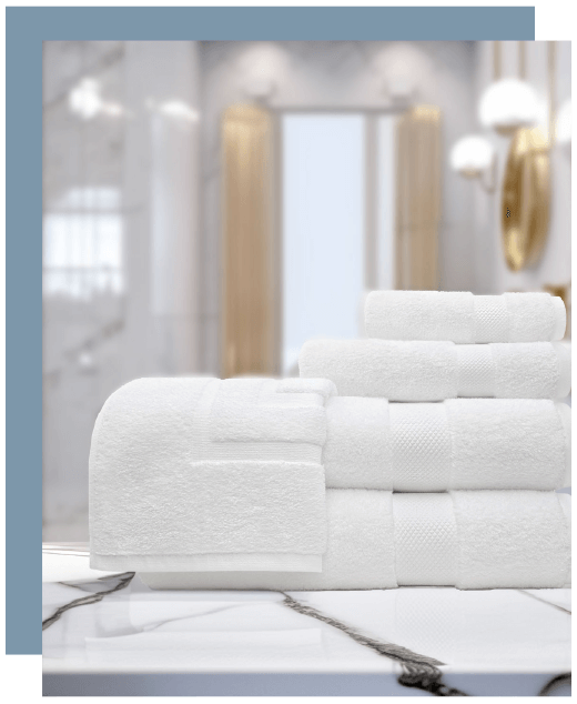 Bundle of white towels on marble countertop